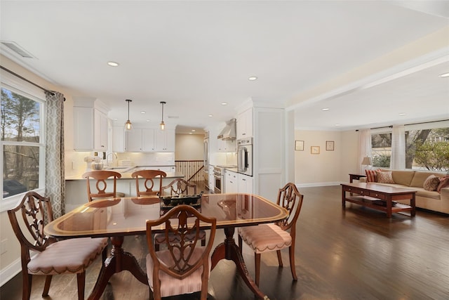 dining area featuring recessed lighting, visible vents, plenty of natural light, and dark wood finished floors