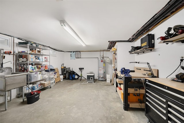 basement with a workshop area and water heater