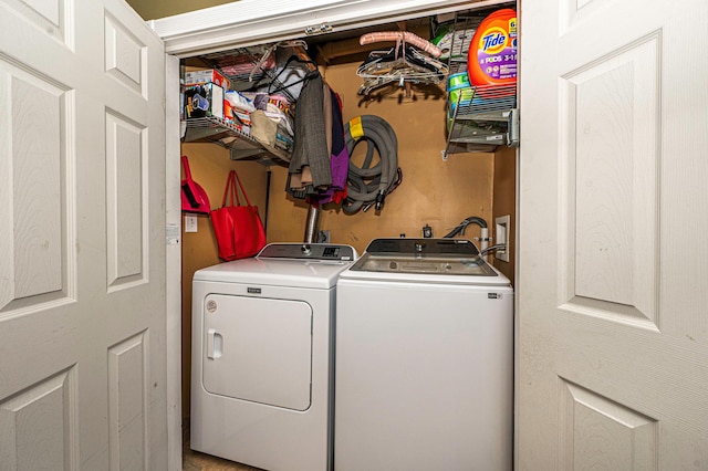 washroom with washing machine and clothes dryer