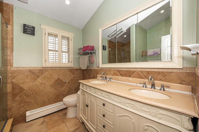 bathroom with walk in shower, vaulted ceiling, tile walls, a baseboard radiator, and vanity