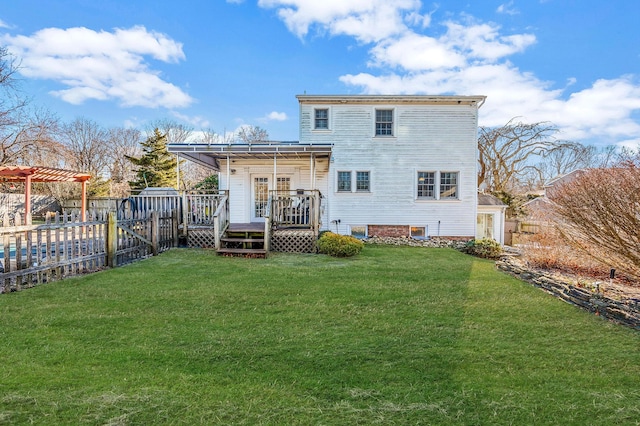 back of property featuring a pergola, a wooden deck, and a yard