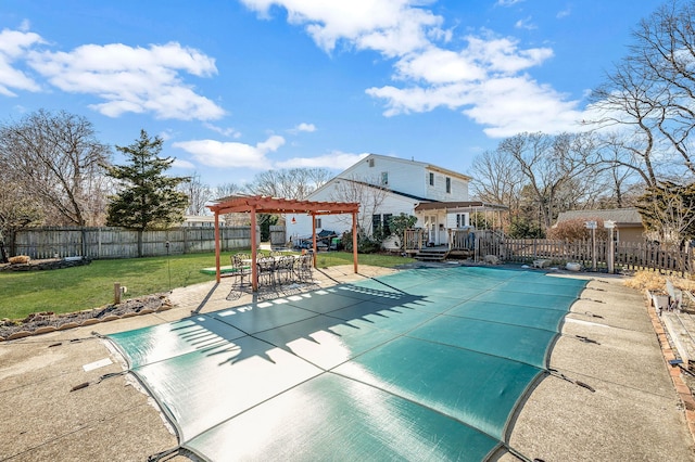 view of pool with a pergola, a lawn, and a patio area