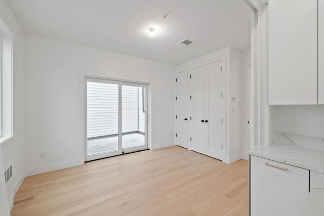 unfurnished bedroom featuring light hardwood / wood-style floors