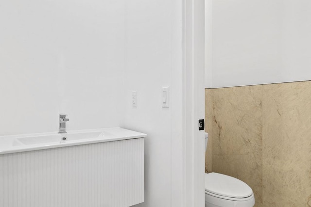 bathroom with sink and toilet