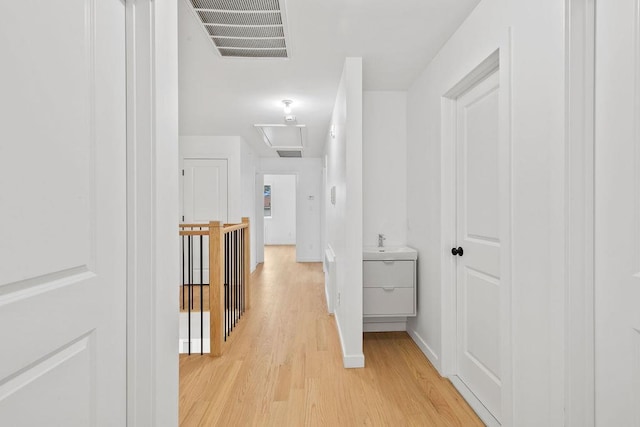 hallway with light wood-type flooring