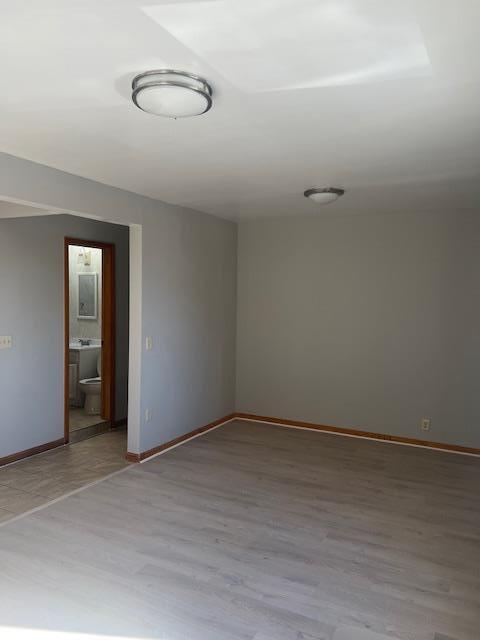 unfurnished room with light hardwood / wood-style flooring