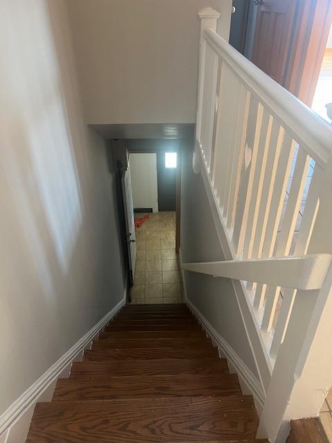 stairway with wood-type flooring