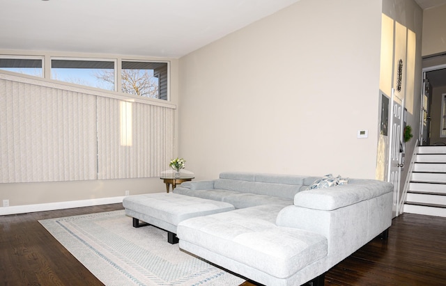 living room with dark hardwood / wood-style flooring