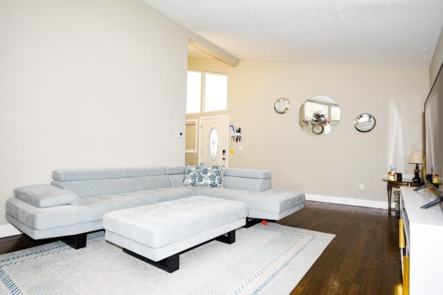 living room with lofted ceiling and dark hardwood / wood-style floors