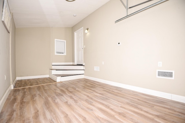 spare room with light hardwood / wood-style flooring