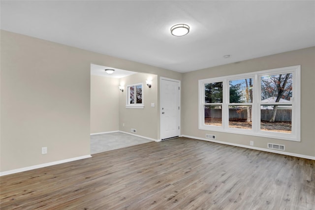 spare room featuring light wood-type flooring