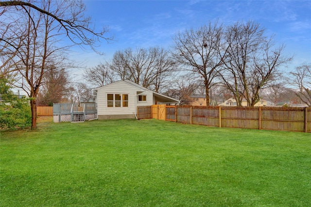 view of yard with a wooden deck