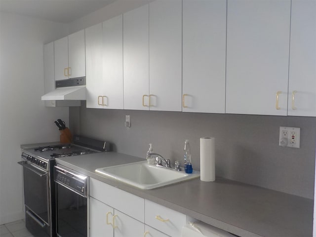 kitchen featuring dishwasher, white cabinetry, sink, and range with gas stovetop