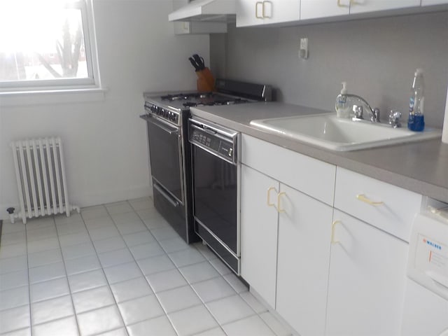 kitchen with radiator heating unit, black dishwasher, sink, white cabinets, and range