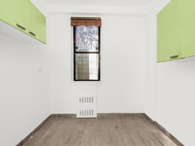 unfurnished room with light hardwood / wood-style flooring