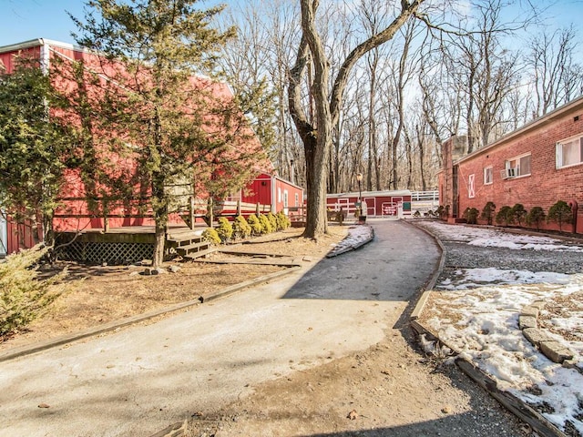 view of property's community featuring a wooden deck