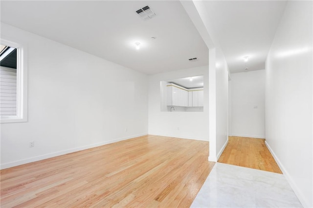 empty room with light hardwood / wood-style floors