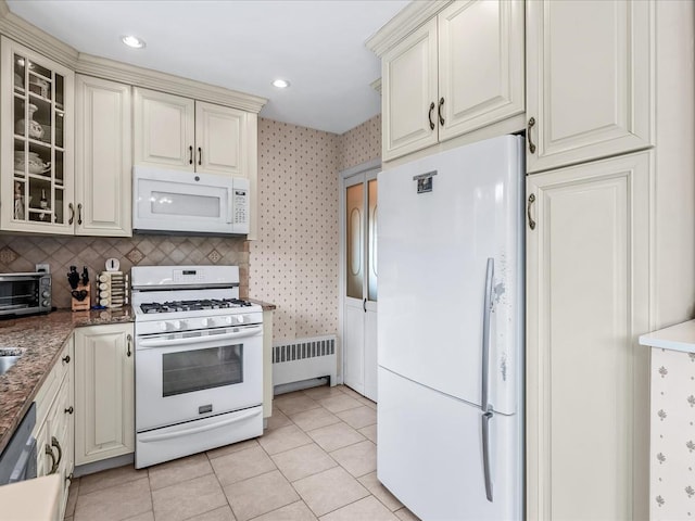 80-51 Little Neck Pkwy, Glen Oaks, NY 11004 - kitchen featuring white appliances, radiator, wallpapered walls, cream cabinets, and glass insert cabinets