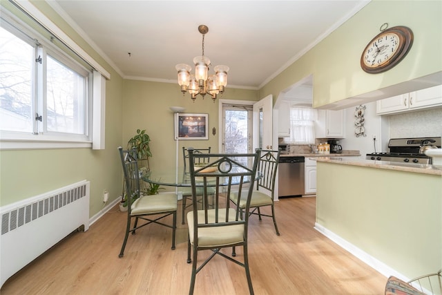 dining space featuring crown molding, radiator, light hardwood / wood-style flooring, and a notable chandelier