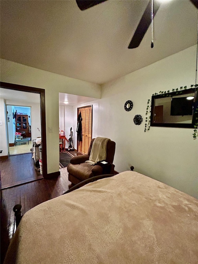 bedroom featuring ceiling fan and dark hardwood / wood-style flooring