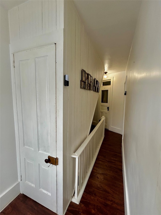 hallway featuring dark hardwood / wood-style flooring