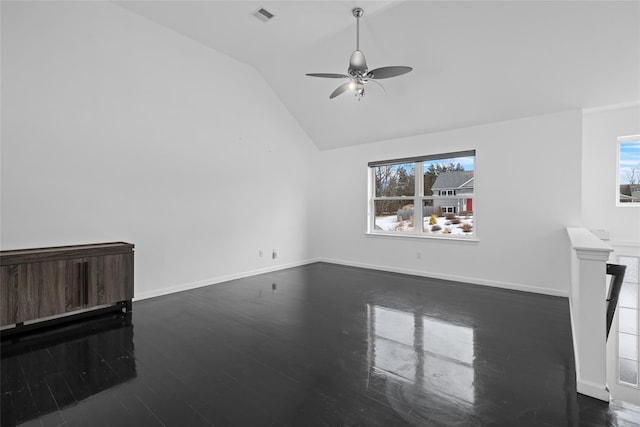 unfurnished living room with dark wood-type flooring, ceiling fan, and lofted ceiling