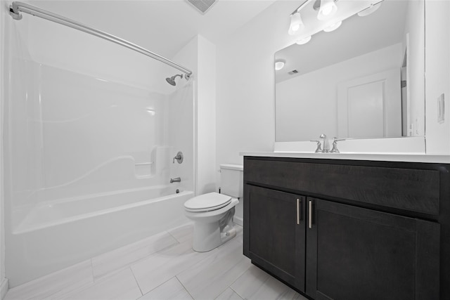 full bathroom featuring bathing tub / shower combination, vanity, and toilet