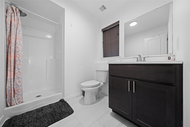 bathroom featuring vanity, walk in shower, and toilet