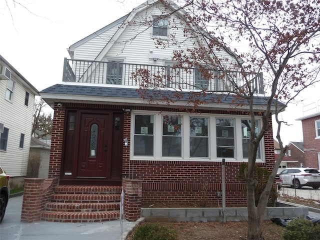 view of front of home with a balcony