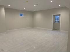 basement featuring light wood-type flooring