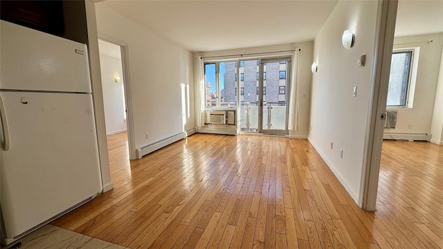 interior space with a baseboard radiator and light wood-type flooring