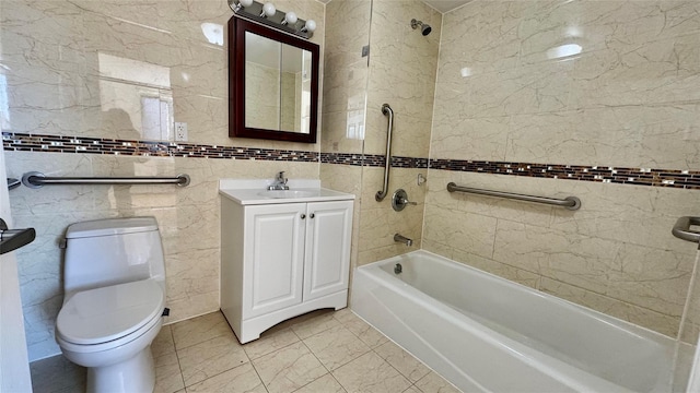 full bathroom with tiled shower / bath, vanity, toilet, and tile walls