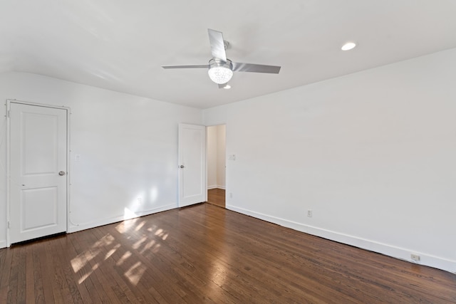 spare room with ceiling fan and dark hardwood / wood-style flooring