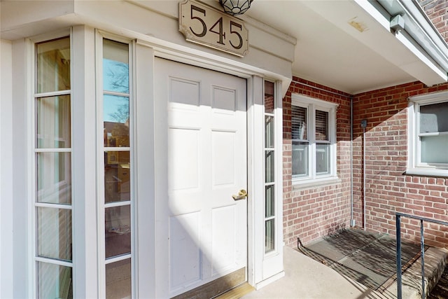 view of exterior entry featuring a porch