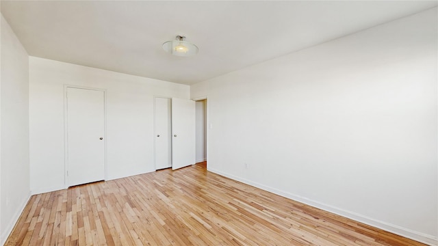 unfurnished bedroom with light hardwood / wood-style floors