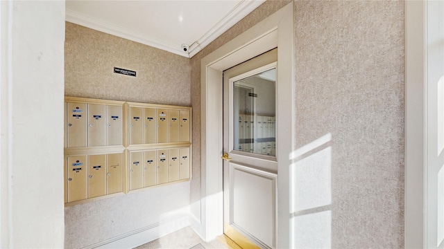 interior space featuring crown molding and a mail area