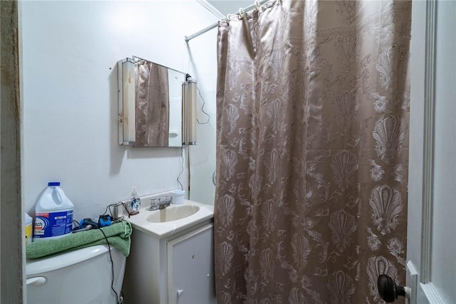 bathroom with vanity, a shower with curtain, and toilet