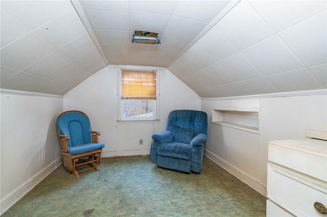 sitting room featuring vaulted ceiling and light colored carpet