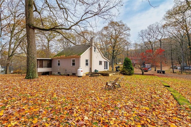 view of home's exterior featuring a sunroom