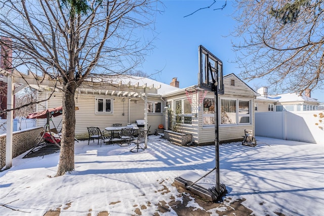 view of snow covered house