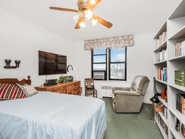 carpeted bedroom featuring radiator heating unit, ceiling fan, and cooling unit