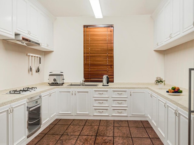 3840 Greystone Ave Unit 3A, Bronx, NY 10463 - kitchen featuring stainless steel oven, under cabinet range hood, a sink, and white cabinets