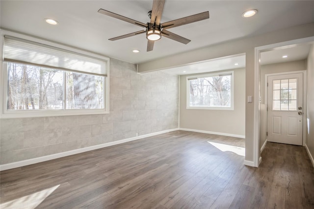 entrance foyer with dark wood-type flooring and ceiling fan