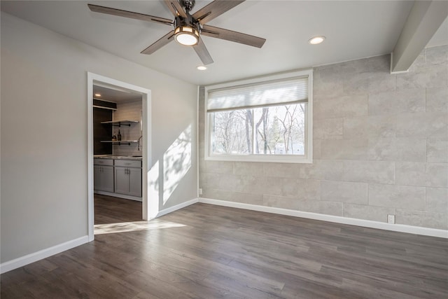 unfurnished room with hardwood / wood-style flooring and ceiling fan