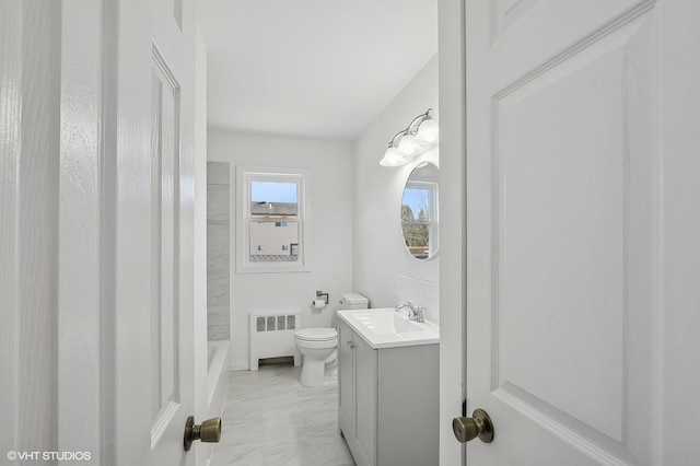 bathroom featuring vanity, radiator, and toilet