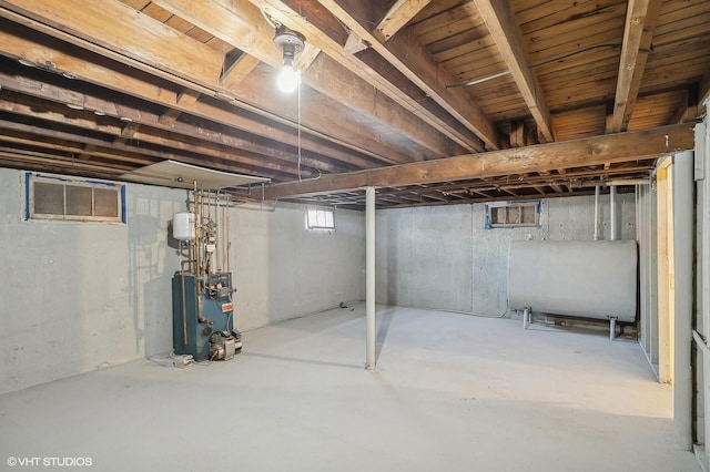 basement featuring heating fuel and a heating unit