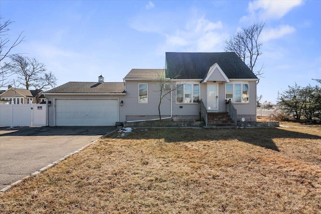 view of front facade with a garage and a front yard