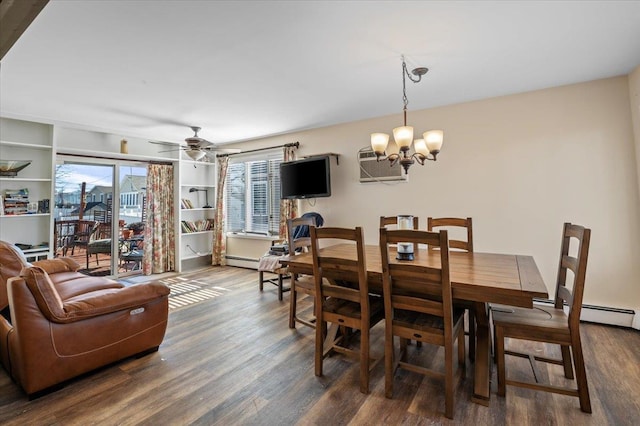 dining space with dark wood-type flooring, a wall mounted AC, ceiling fan with notable chandelier, and a baseboard heating unit