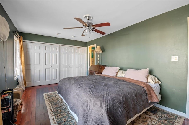 bedroom with ceiling fan, dark hardwood / wood-style flooring, and a closet