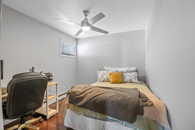 bedroom with hardwood / wood-style floors and ceiling fan